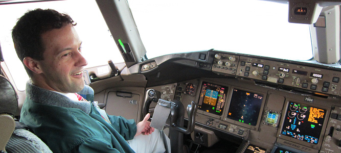 Robert Chapin in the left seat of a Boeing 777 cockpit.