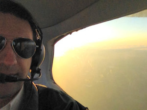 Rob riding back seat in a Cessna 172 over Texas